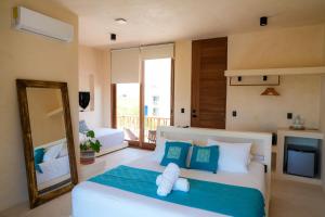 Postel nebo postele na pokoji v ubytování Tikul Hotel Boutique