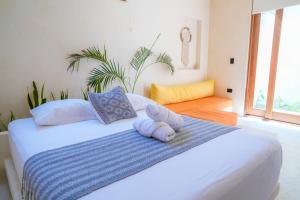Postel nebo postele na pokoji v ubytování Tikul Hotel Boutique