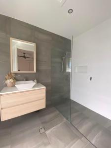 a bathroom with a sink and a shower at Ranch Retreat in Kewarra Beach