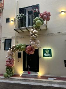 a bunch of balloons in front of a building at Borgo La Chiusa in Cinisi