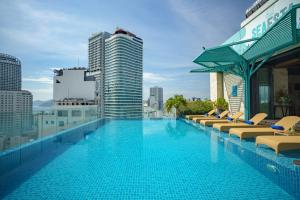 a large swimming pool on top of a building at Seaesta Nha Trang Hotel in Nha Trang