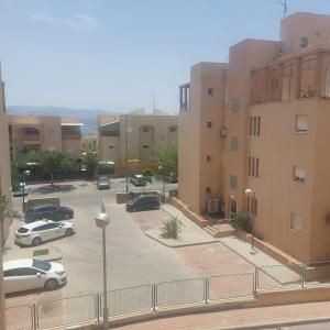 a parking lot with cars parked in a parking lot at bloom in Eilat