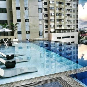 a large swimming pool in front of a building at Shiela Stays Cebu Condo in Cebu City
