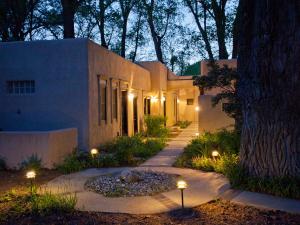 a house with lights on the side of it at Palacio de Marquesa in Taos