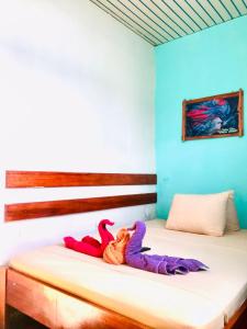 Postel nebo postele na pokoji v ubytování SELVA VIVA IQUITOS
