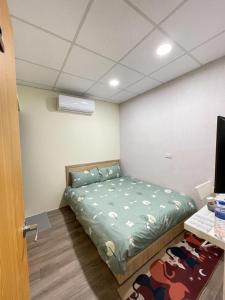Letto o letti in una camera di 漫旅溫泉會館-愛娜