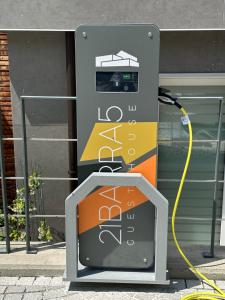 a gas pump with a yellow cord plugged into it at 21Barra5 Guest House in Aosta