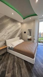 Postel nebo postele na pokoji v ubytování Suites Matteotti 57