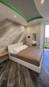 Postel nebo postele na pokoji v ubytování Suites Matteotti 57