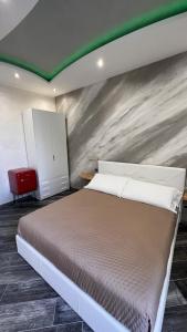 Postel nebo postele na pokoji v ubytování Suites Matteotti 57