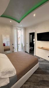 Postel nebo postele na pokoji v ubytování Suites Matteotti 57