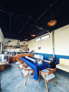 a row of tables and chairs in a restaurant at Deodar Homestay in Almora