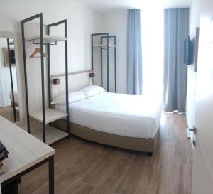 Postel nebo postele na pokoji v ubytování Hotel Cantoria