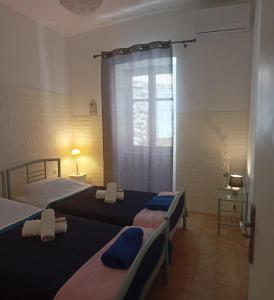 Postel nebo postele na pokoji v ubytování Smaragdas Paradise