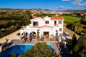 an aerial view of a house with a swimming pool at Cocoon Luxury Villa In Coral Bay-3 Min To Beach in Peyia