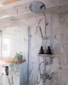 a shower in a bathroom with marble walls at Cocoon Luxury Villa In Coral Bay-3 Min To Beach in Peyia