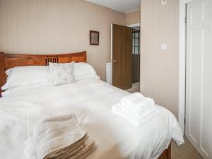 מיטה או מיטות בחדר ב-The Rennie Mackintosh Retreat