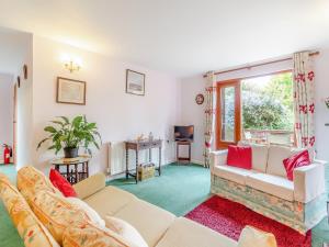 a living room with two couches and a window at Bryanstown Annexe in Woodbridge