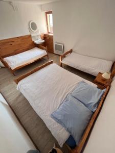 Ένα ή περισσότερα κρεβάτια σε δωμάτιο στο Auberge de Sauze