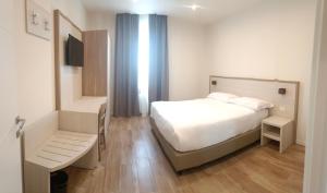 Postel nebo postele na pokoji v ubytování Hotel Cantoria