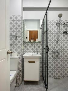 a bathroom with a white sink and a shower at High Ceiling Authentic Historic Ottoman Home! #49 in Istanbul