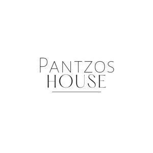 a sign for a parisos house at Pantzos House in Paradisos