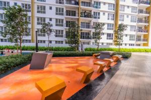 a row of benches in front of a building at Zen 3-bedroom w pool 6 pax - Semarak in Kuala Lumpur