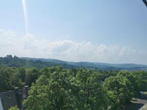 a view of the mountains from the balcony of a house at Moderne Ferienwohnung Iserlohn in Iserlohn