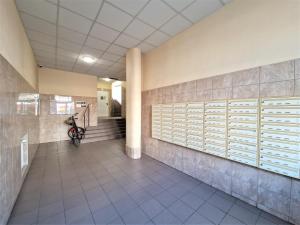 a hallway of a building with a scooter parked in it at J&W Apartments Grójecka Glam Flat in Warsaw