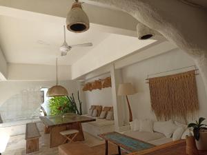 a living room with a couch and a table at Sal Central in Uluwatu
