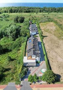 an aerial view of a building in a field at Ośrodek Wypoczynkowy SWALLOW in Grzybowo