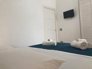 Postel nebo postele na pokoji v ubytování B&B Sabbia e Sassi