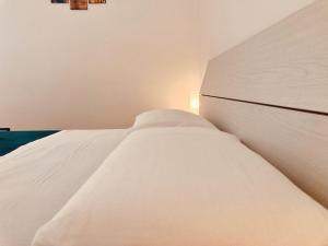 Postel nebo postele na pokoji v ubytování B&B Sabbia e Sassi