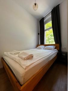 Posteľ alebo postele v izbe v ubytovaní BISCHOFSBERG Gdańsk City Center Apartments