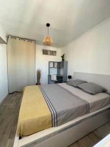 Posteľ alebo postele v izbe v ubytovaní Appartement centre ville 4 personnes à Palavas les flots
