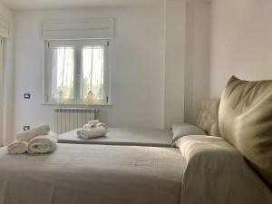 Postel nebo postele na pokoji v ubytování B&B Sabbia e Sassi