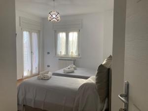 Postel nebo postele na pokoji v ubytování B&B Sabbia e Sassi