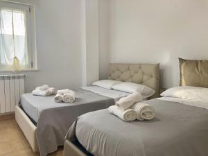 Postel nebo postele na pokoji v ubytování B&B Sabbia e Sassi