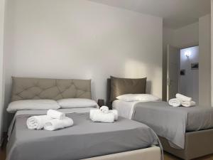 Postel nebo postele na pokoji v ubytování B&B Sabbia e Sassi