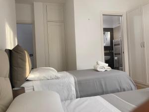 Postel nebo postele na pokoji v ubytování B&B Sabbia e Sassi