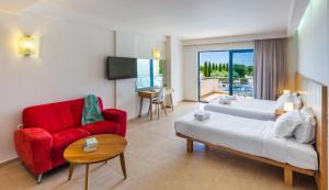 A bed or beds in a room at Ionian Theoxenia
