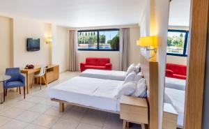 A bed or beds in a room at Ionian Theoxenia