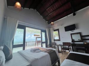 Postel nebo postele na pokoji v ubytování The Poplar Resort Phú Quốc