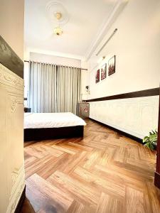 Postel nebo postele na pokoji v ubytování BÊ TÔNG RESIDENCES HOMESTAY
