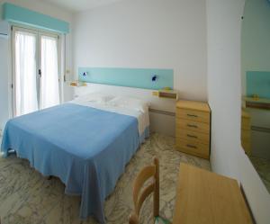 Postel nebo postele na pokoji v ubytování Albergo Il Veliero