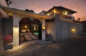 a house with an entryway with a patio at Sudha Villa Bali Anyelir in Seminyak