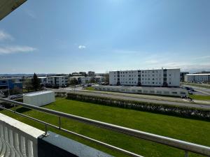 a view of a city with buildings and a green field at Cosy apartment centrally located in Reykjavik in Reykjavík