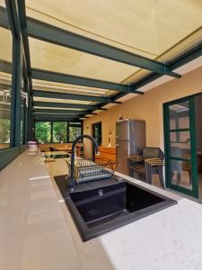 a kitchen with a sink and a counter top at Luna di Rose in Portorož