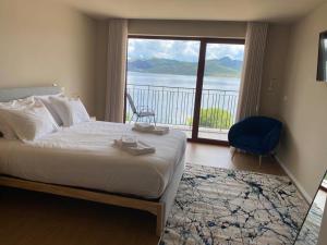 a bedroom with a bed and a window with a view at Belas Vistas Hotel in Montalegre