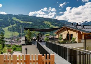 a balcony with a view of the mountains at Ferienalm Panorama Hotel in Schladming